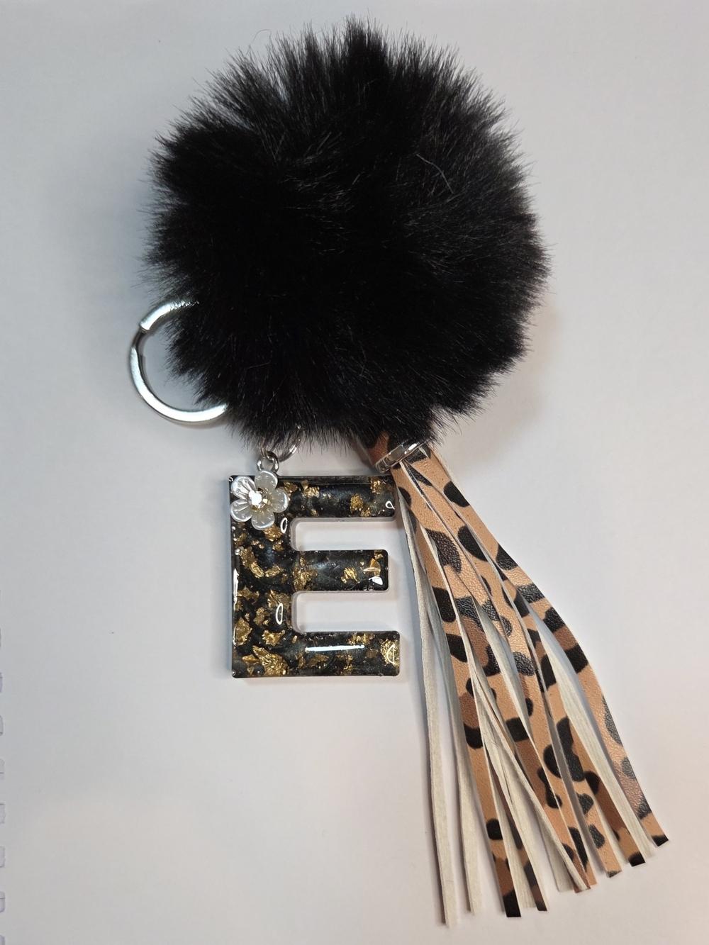 Black Faux Fur Pom Keychain with Gold Fleck 'E' Resin Charm and Leopard Tassel